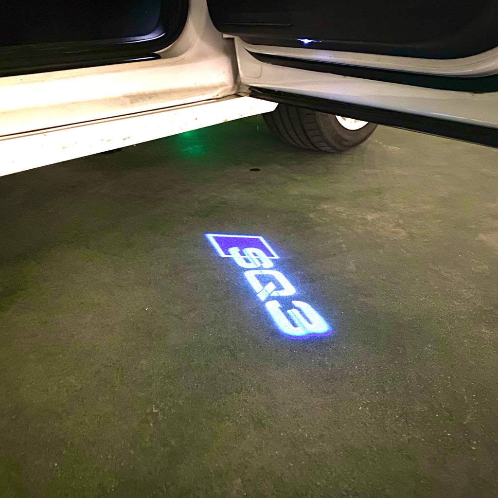 AUDI LOGO PROJECTOT LIGHTS Nr.120 (الكمية 1 = 2 Logo Films /2 أضواء الباب)