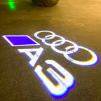 AUDI LOGO PROJECTOT LIGHTS Nr.120 (الكمية 1 = 2 Logo Films /2 أضواء الباب)