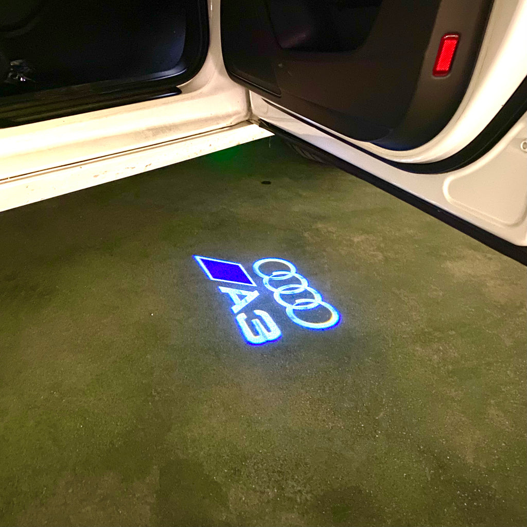 AUDI LOGO PROJECTOT LIGHTS Nr.120 (الكمية 1 = 2 Logo Films /2 أضواء الباب)