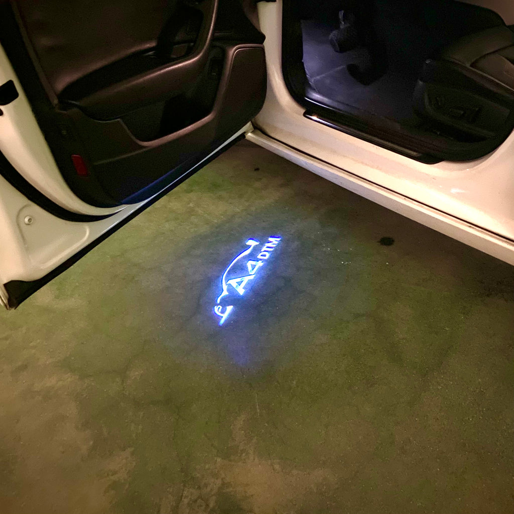 AUDI LOGO PROJECTOT LIGHTS Nr.120 (الكمية 1 = 2 Logo Films /2 أضواء الباب)