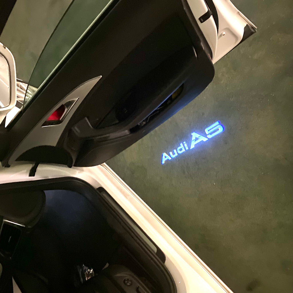 AUDI LOGO PROJECTOT LIGHTS Nr.120 (الكمية 1 = 2 Logo Films /2 أضواء الباب)