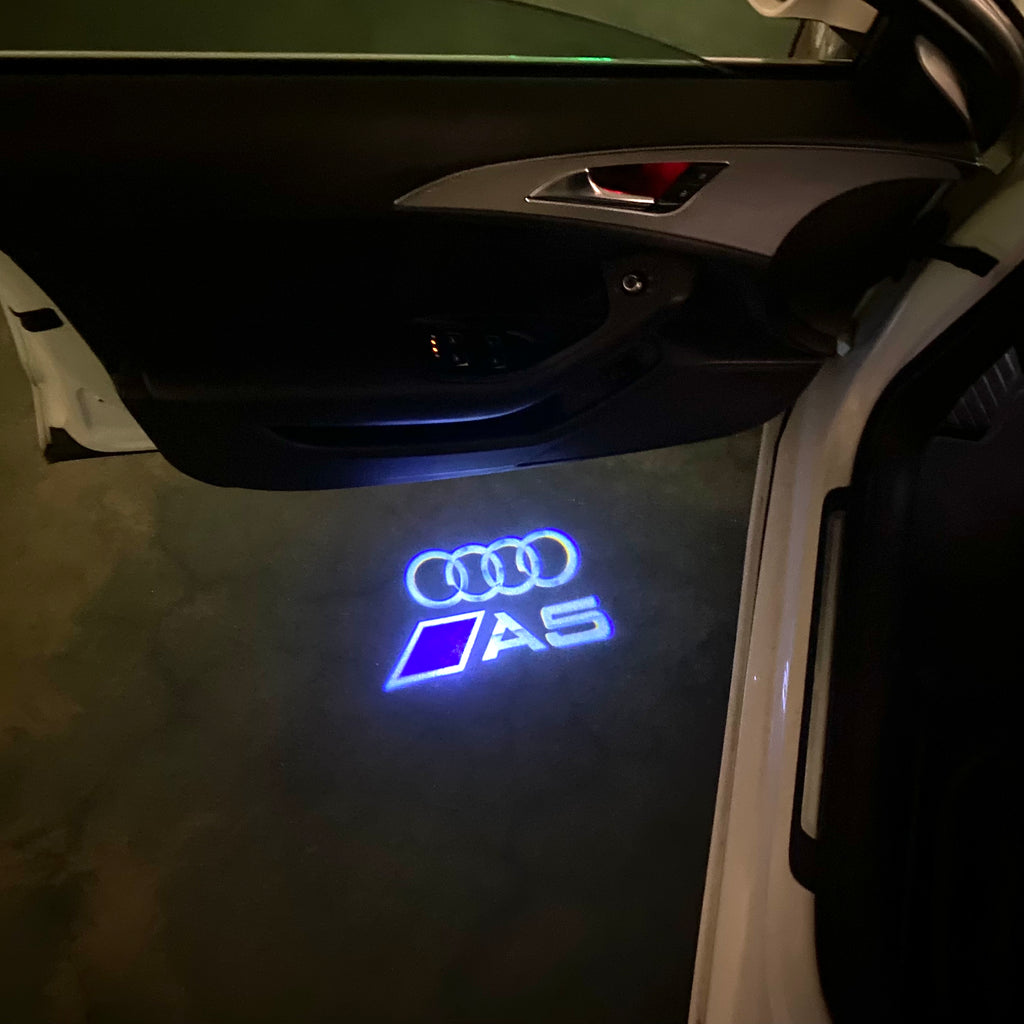 AUDI LOGO PROJECTOT LIGHTS Nr.120 (الكمية 1 = 2 Logo Films /2 أضواء الباب)