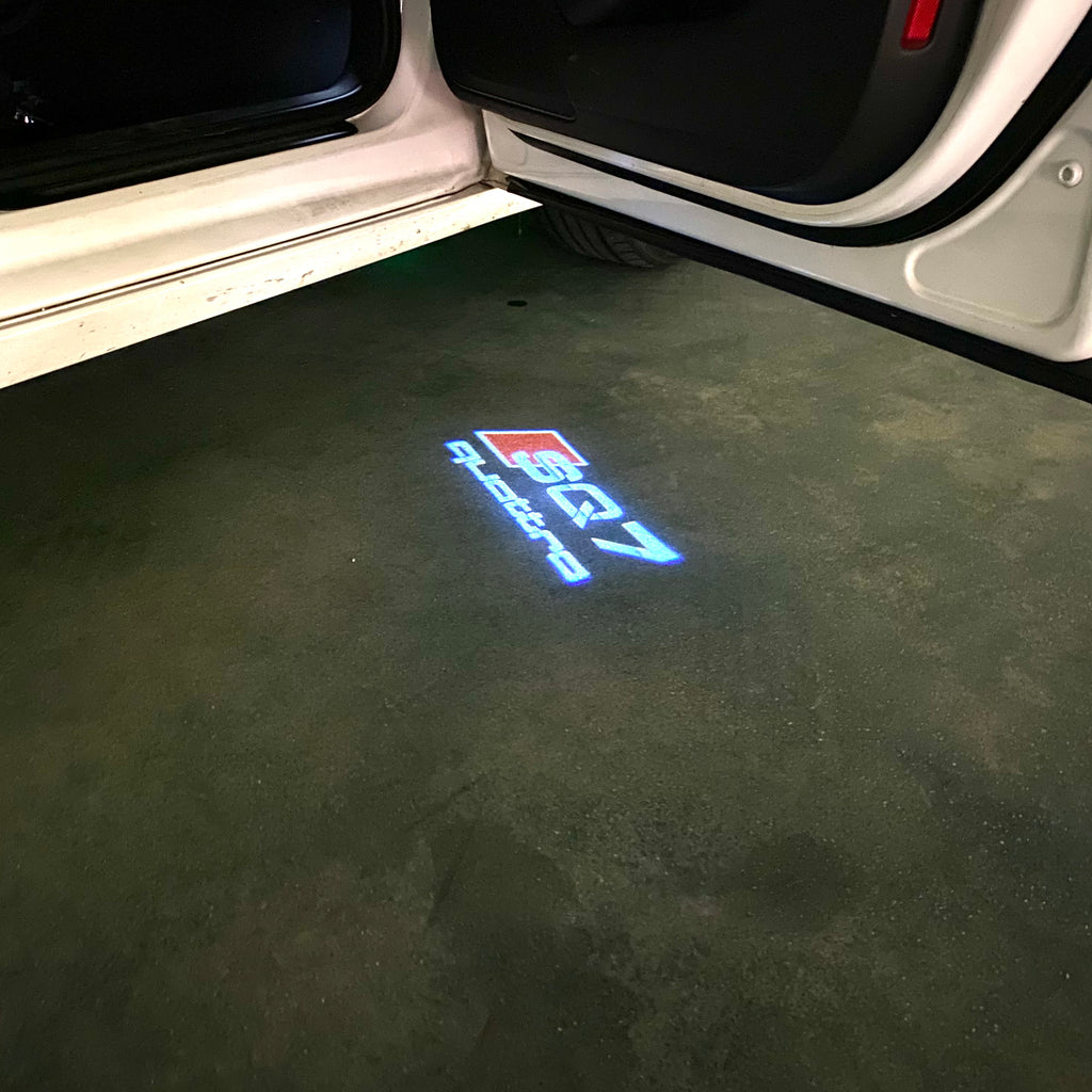 AUDI LOGO PROJECTOT LIGHTS Nr.120 (الكمية 1 = 2 Logo Films /2 أضواء الباب)