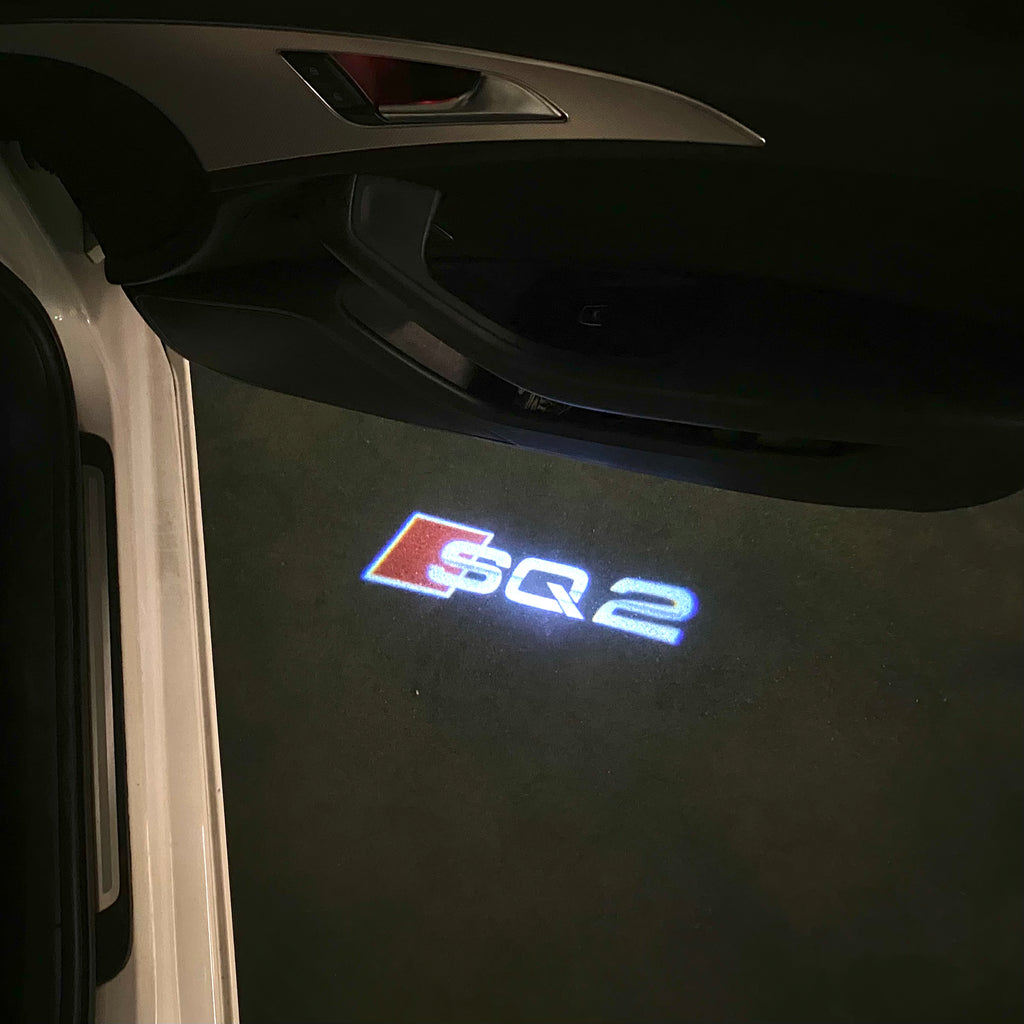 AUDI LOGO PROJECTOT LIGHTS Nr.120 (الكمية 1 = 2 Logo Films /2 أضواء الباب)