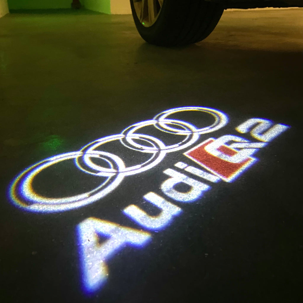 AUDI LOGO PROJECTOT LIGHTS Nr.120 (الكمية 1 = 2 Logo Films /2 أضواء الباب)