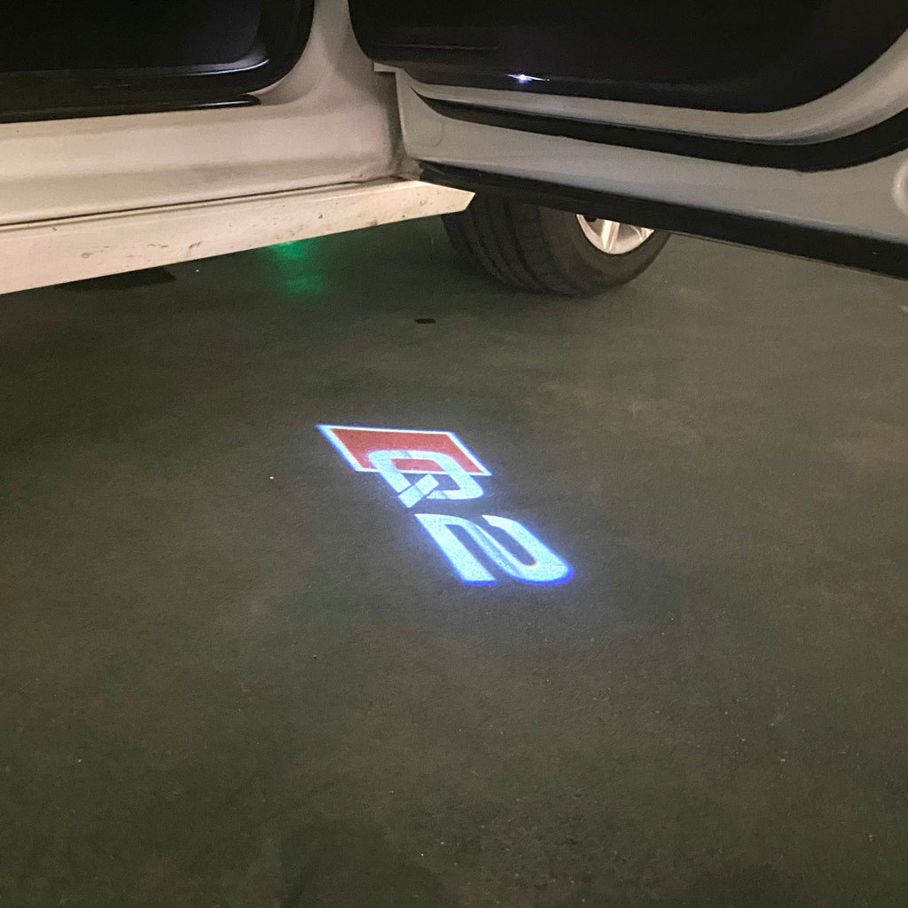 AUDI LOGO PROJECTOT LIGHTS Nr.120 (الكمية 1 = 2 Logo Films /2 أضواء الباب)