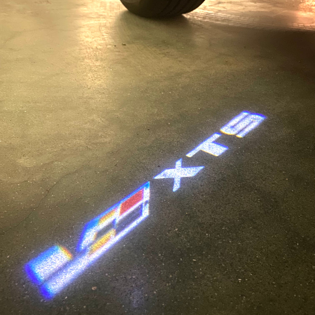 CADILLAC XTS LOGO PROJECTOT LIGHTS Nr.9802 (quantity 1 = 2 Logo Films /2 door lights）