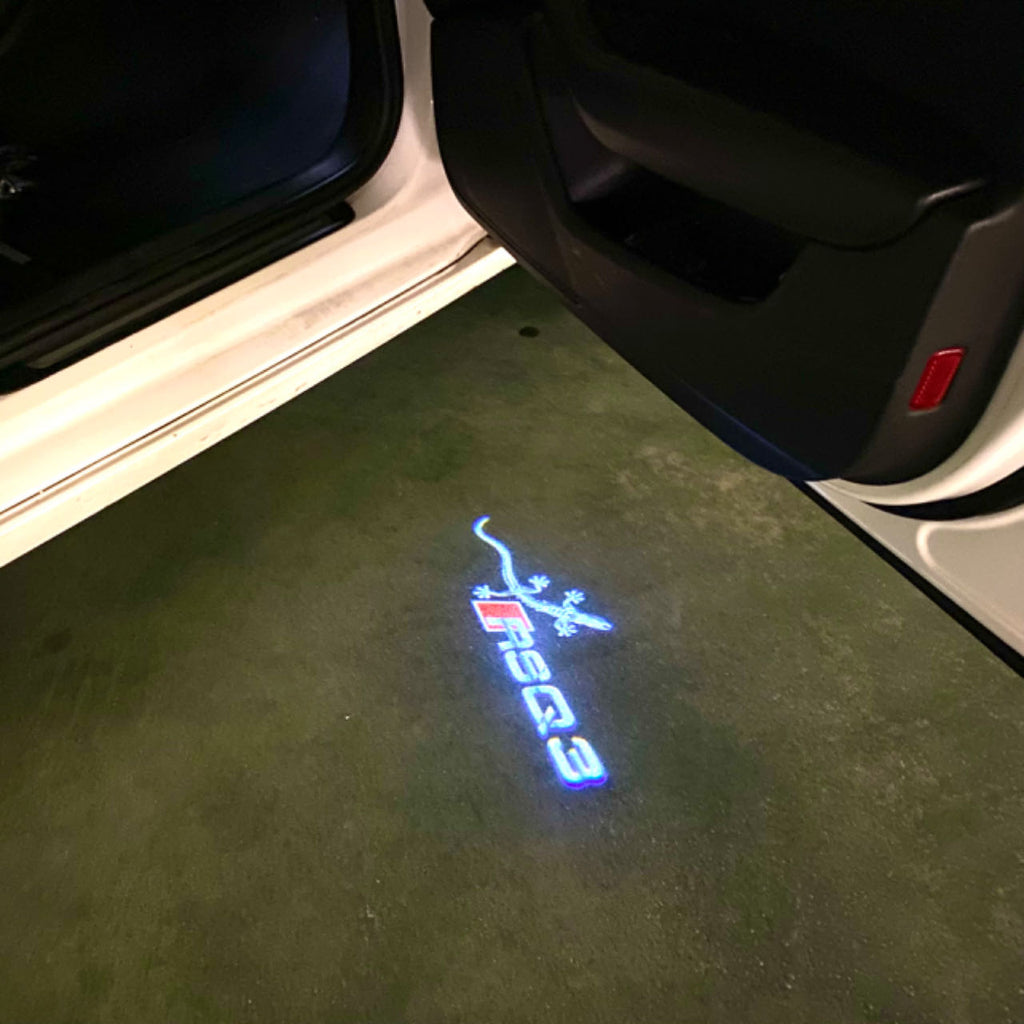AUDI LOGO PROJECTOT LIGHTS Nr.120 (الكمية 1 = 2 Logo Films /2 أضواء الباب)