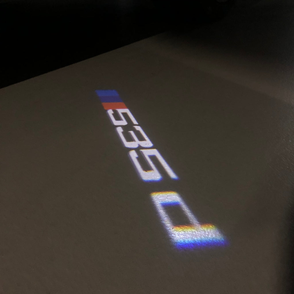 ÉCLAIRAGE DE PROJECTEUR BMW M3 LOGO Nr.24 (quantité 1 = 1 jeux / 2 feux de porte)