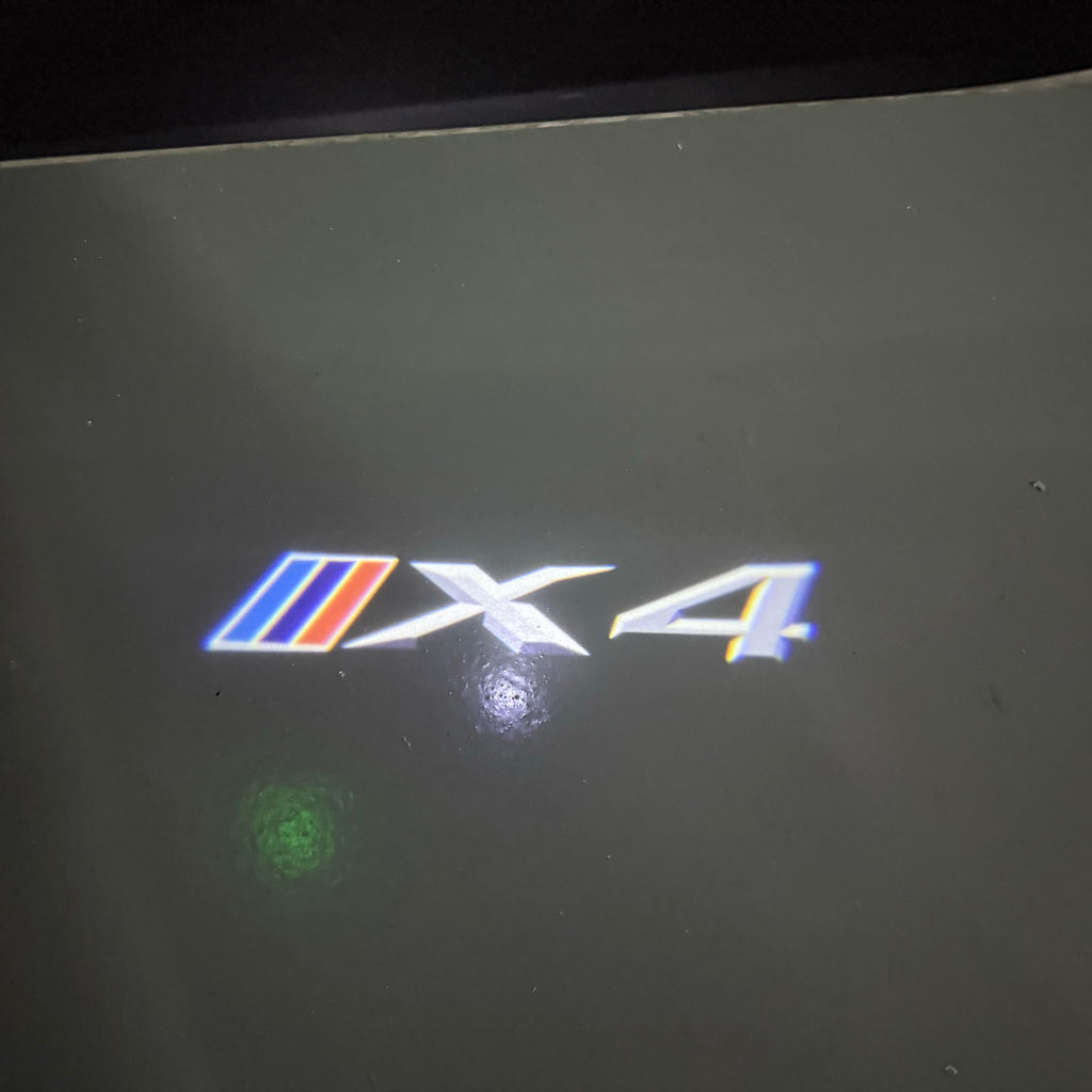 BMW X4  LOGO PROJECTOT LIGHTS (quantity 1 = 1 sets/2 door lights) Nr.6024q0t032