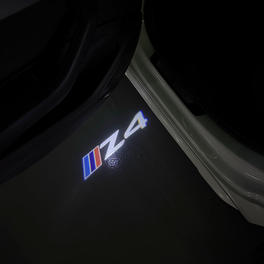 BMW Z4  LOGO PROJECTOT LIGHTS (quantity 1 = 1 sets/2 door lights) Nr.6024q0t0128
