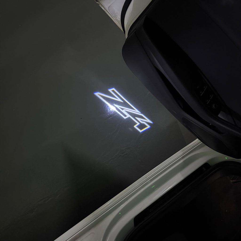 BMW  Z4  LOGO PROJECTOT LIGHTS (quantity 1 = 1 sets/2 door lights) Nr.6024q0t0135