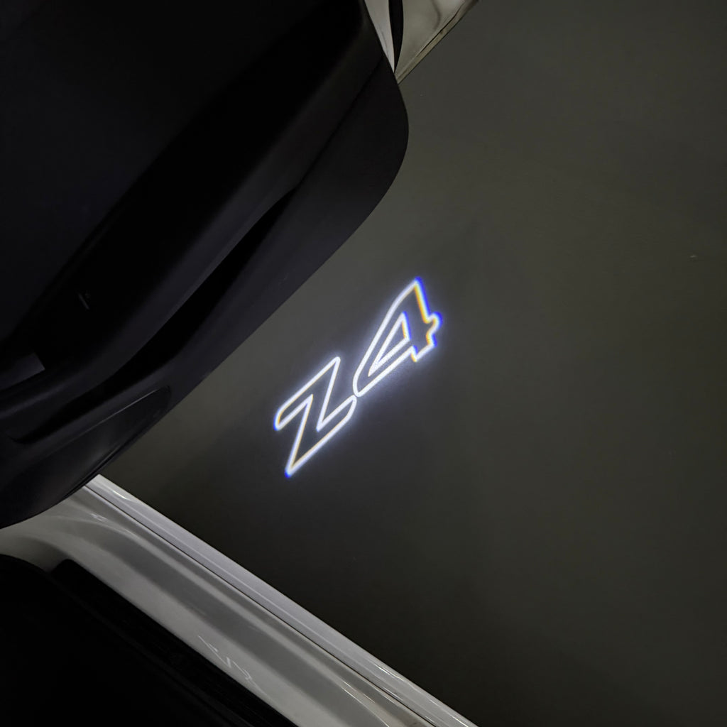 BMW Z4    LOGO PROJECTOT LIGHTS (quantity 1 = 1 sets/2 door lights) Nr.6024q0t0136
