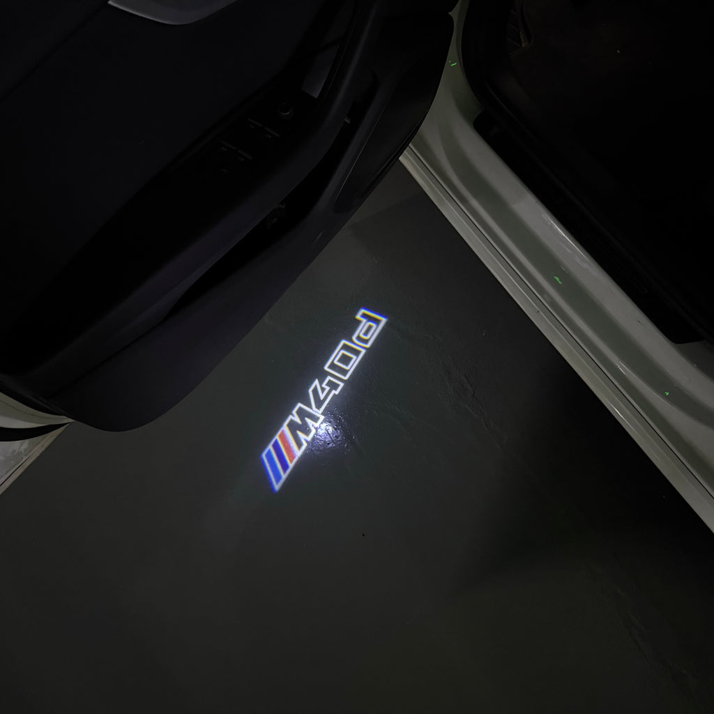 BMW M3 LOGO PROJECTOR LIGHTS Nr.24 (الكمية 1 = 1 مجموعة / 2 أضواء باب)