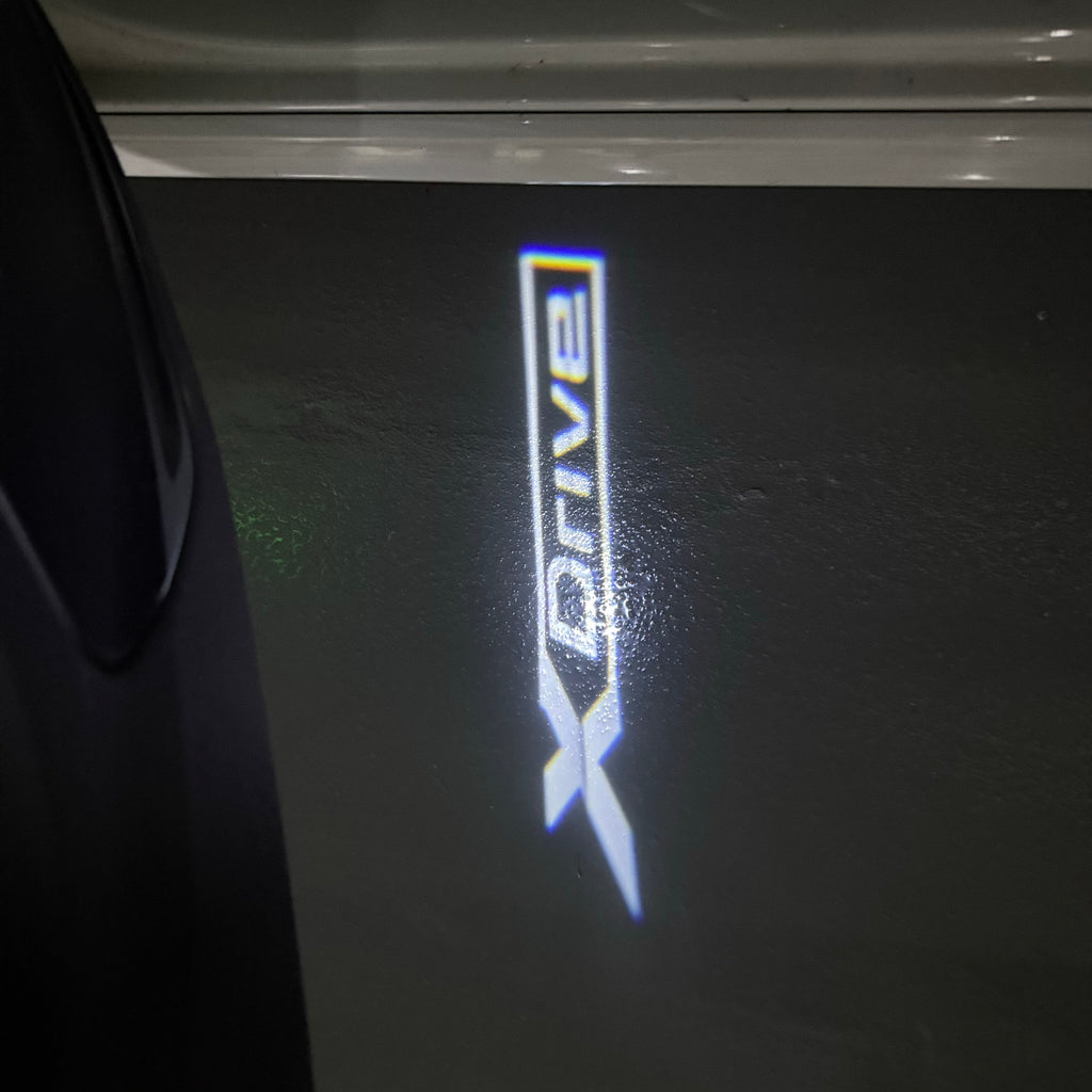 BMW X Drive  LOGO PROJECTOT LIGHTS (quantity 1 = 1 sets/2 door lights) Nr.6024q179