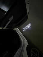 BMW X6  LOGO PROJECTOT LIGHTS (quantity 1 = 1 sets/2 door lights) Nr.6024q0t051