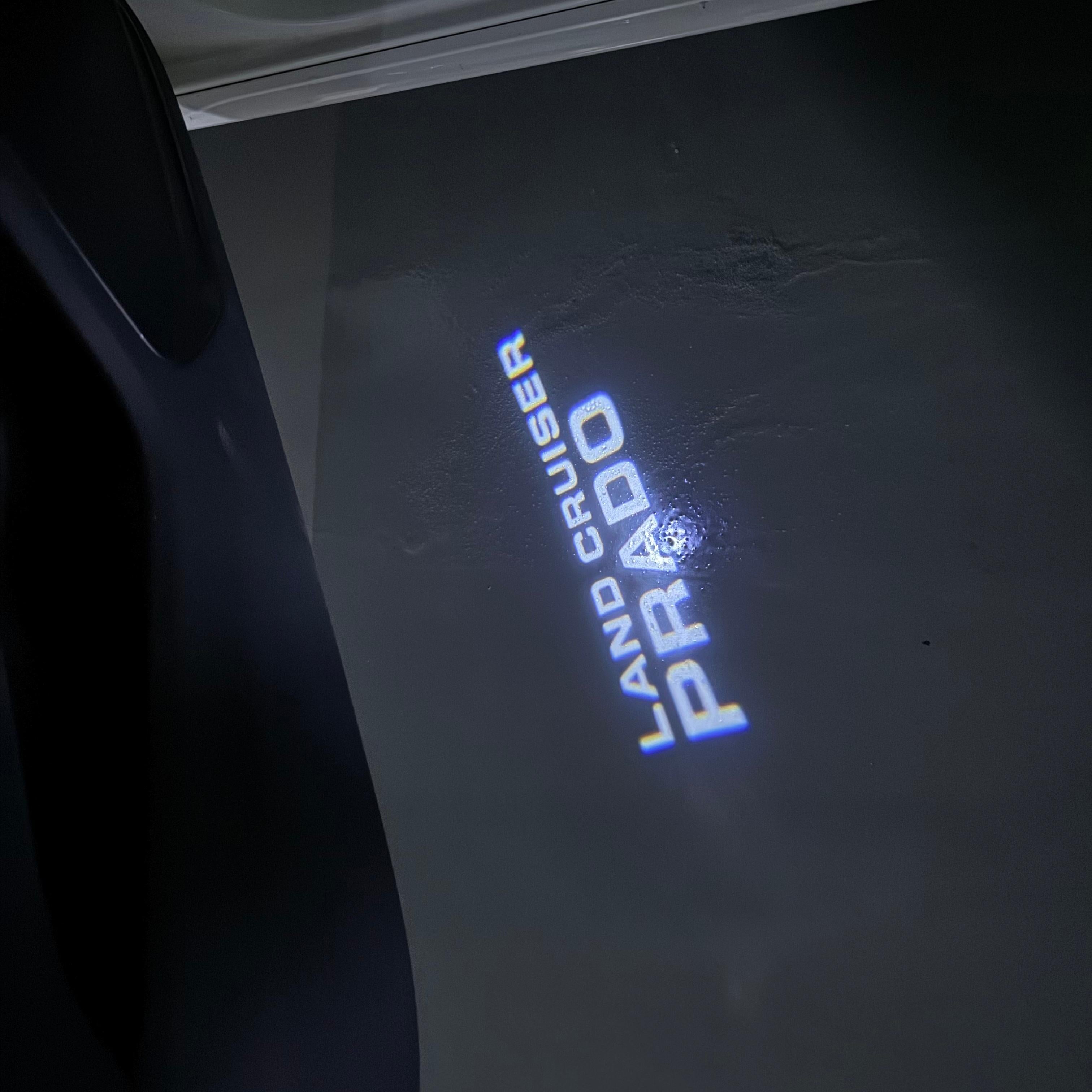 TOYOTA  PRADO LOGO PROJECROTR LIGHTS  (quantity 1 = 1 sets/2 door lights) Nr.0G13