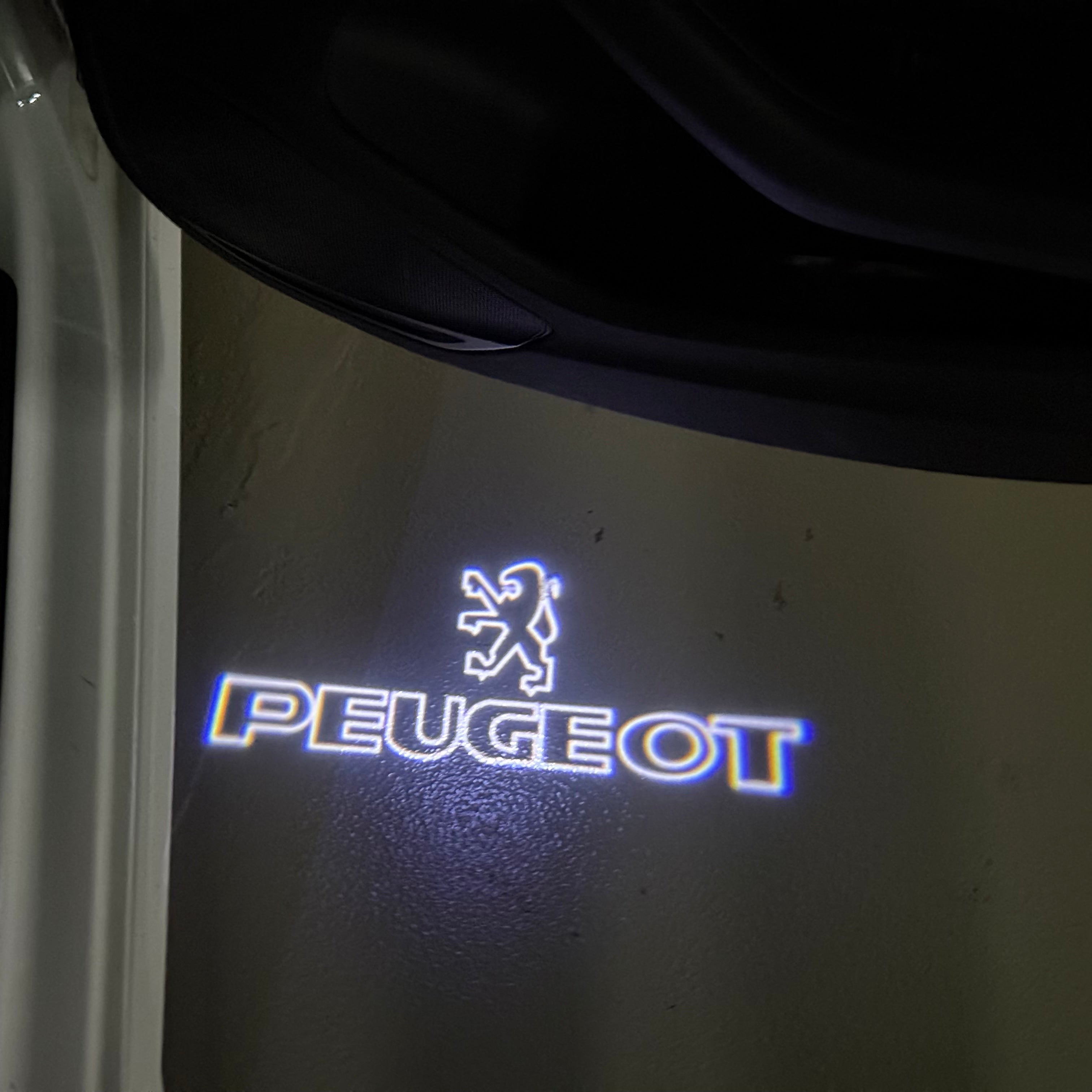 PEUGEOT ORIGINAL  LOGO PROJECTOT LIGHTS (quantity 1 = 1 sets/2 door lights) Nr.6024q69