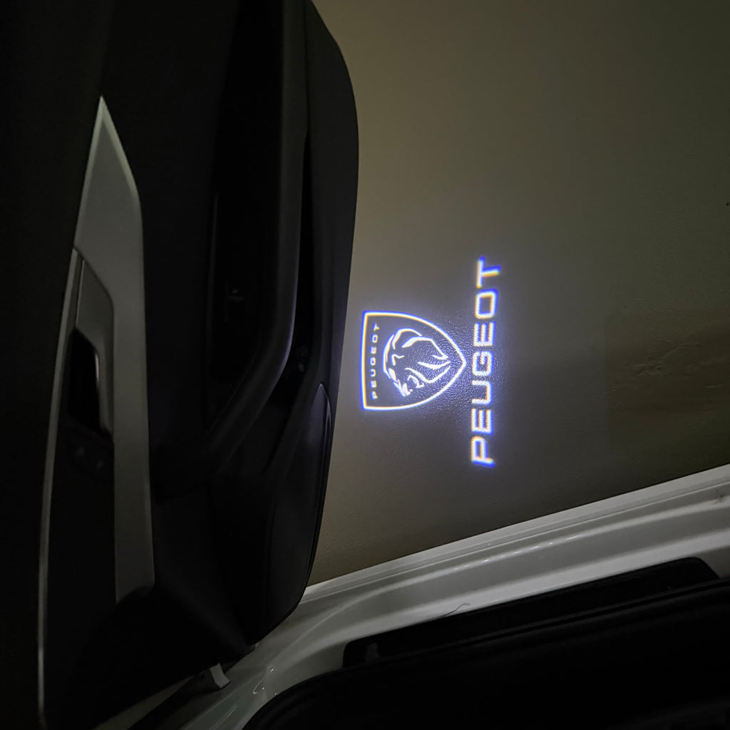 PEUGEOT ORIGINAL  LOGO PROJECTOT LIGHTS (quantity 1 = 1 sets/2 door lights) Nr.6024q71