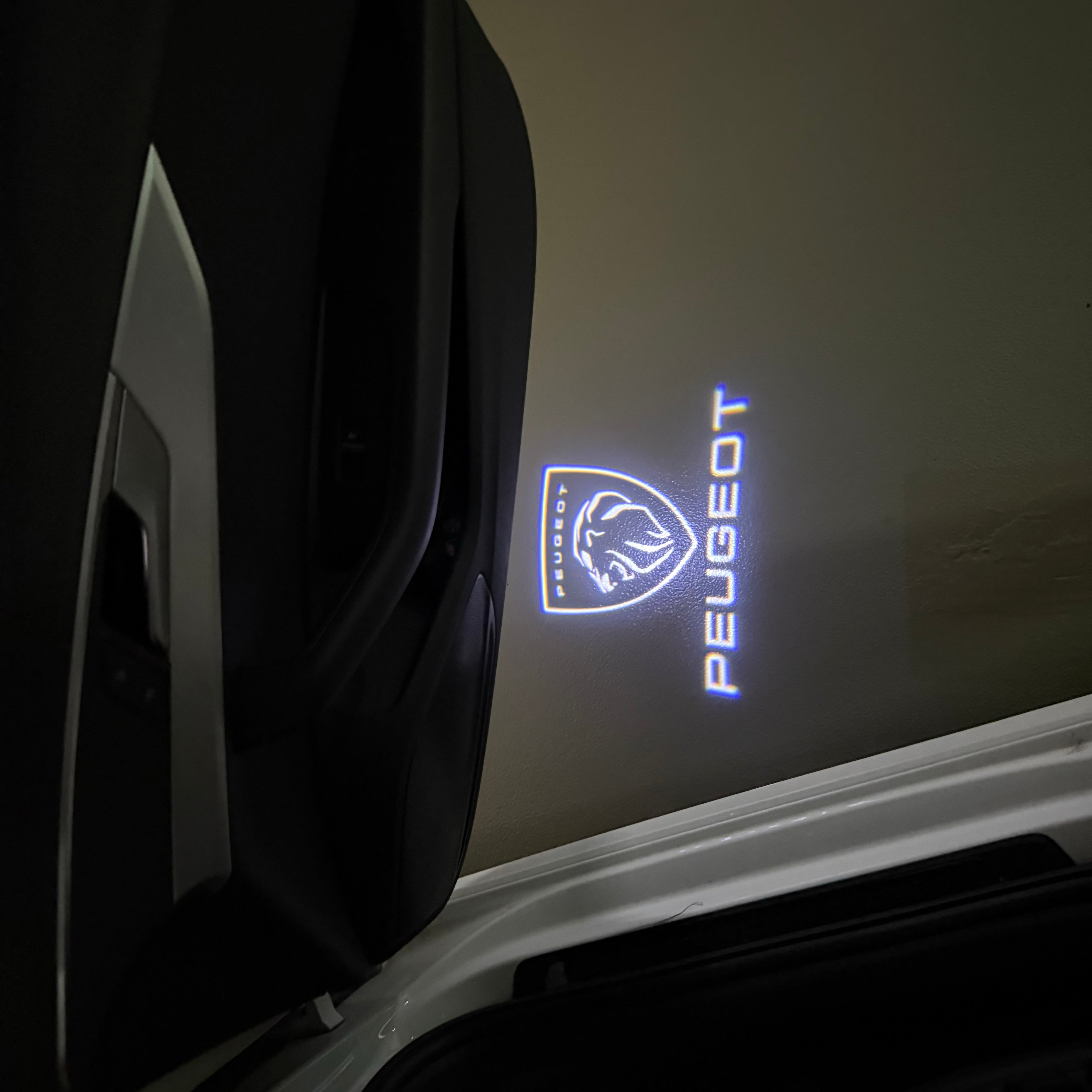 PEUGEOT ORIGINAL  LOGO PROJECTOT LIGHTS (quantity 1 = 1 sets/2 door lights) Nr.6024q71