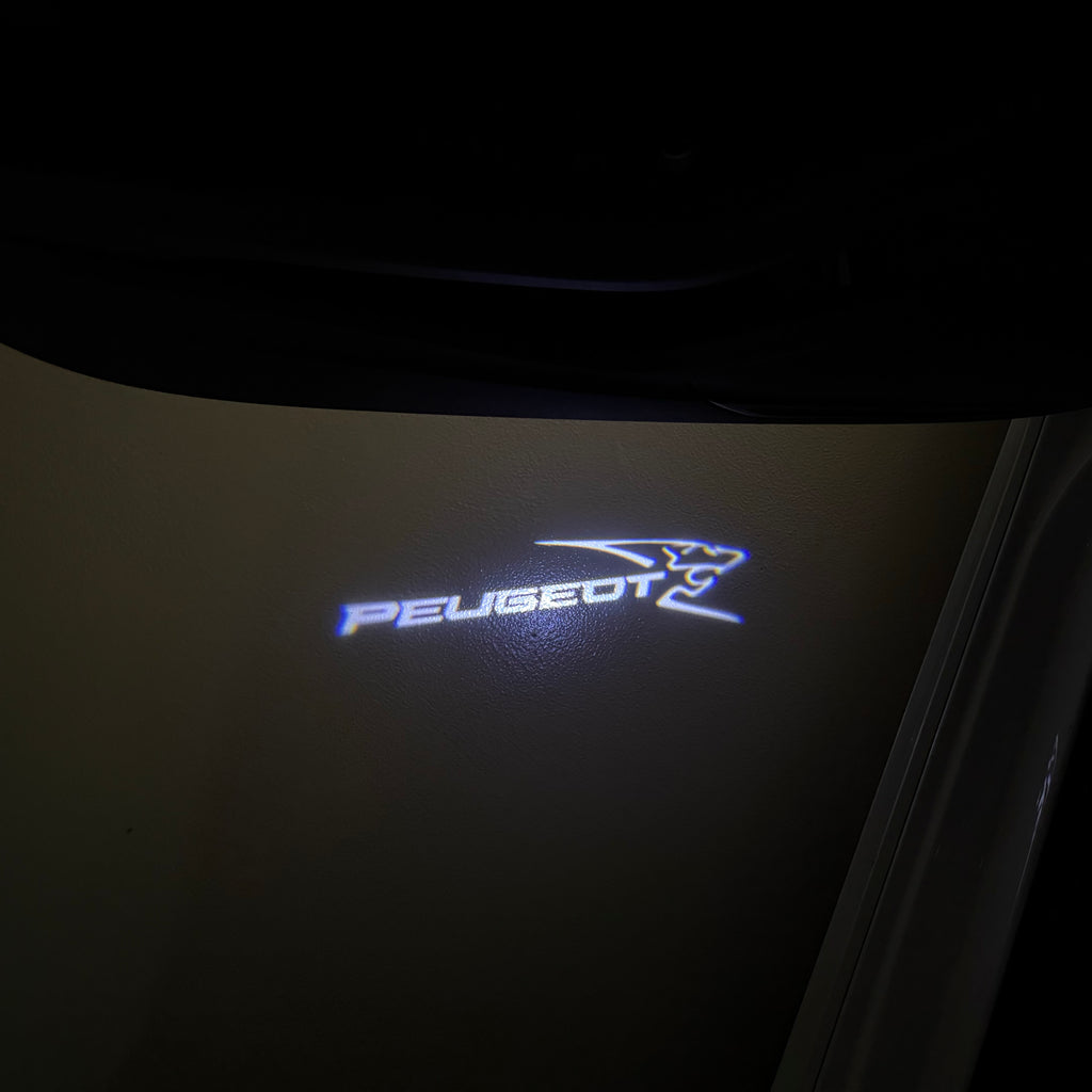 PEUGEOT ORIGINAL  LOGO PROJECTOT LIGHTS (quantity 1 = 1 sets/2 door lights) Nr.6024q64