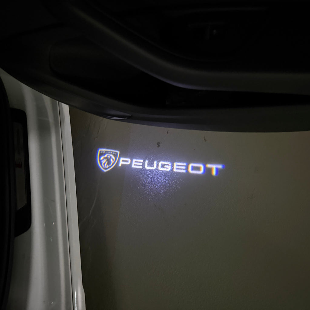 PEUGEOT ORIGINAL  LOGO PROJECTOT LIGHTS (quantity 1 = 1 sets/2 door lights) Nr.6024q63