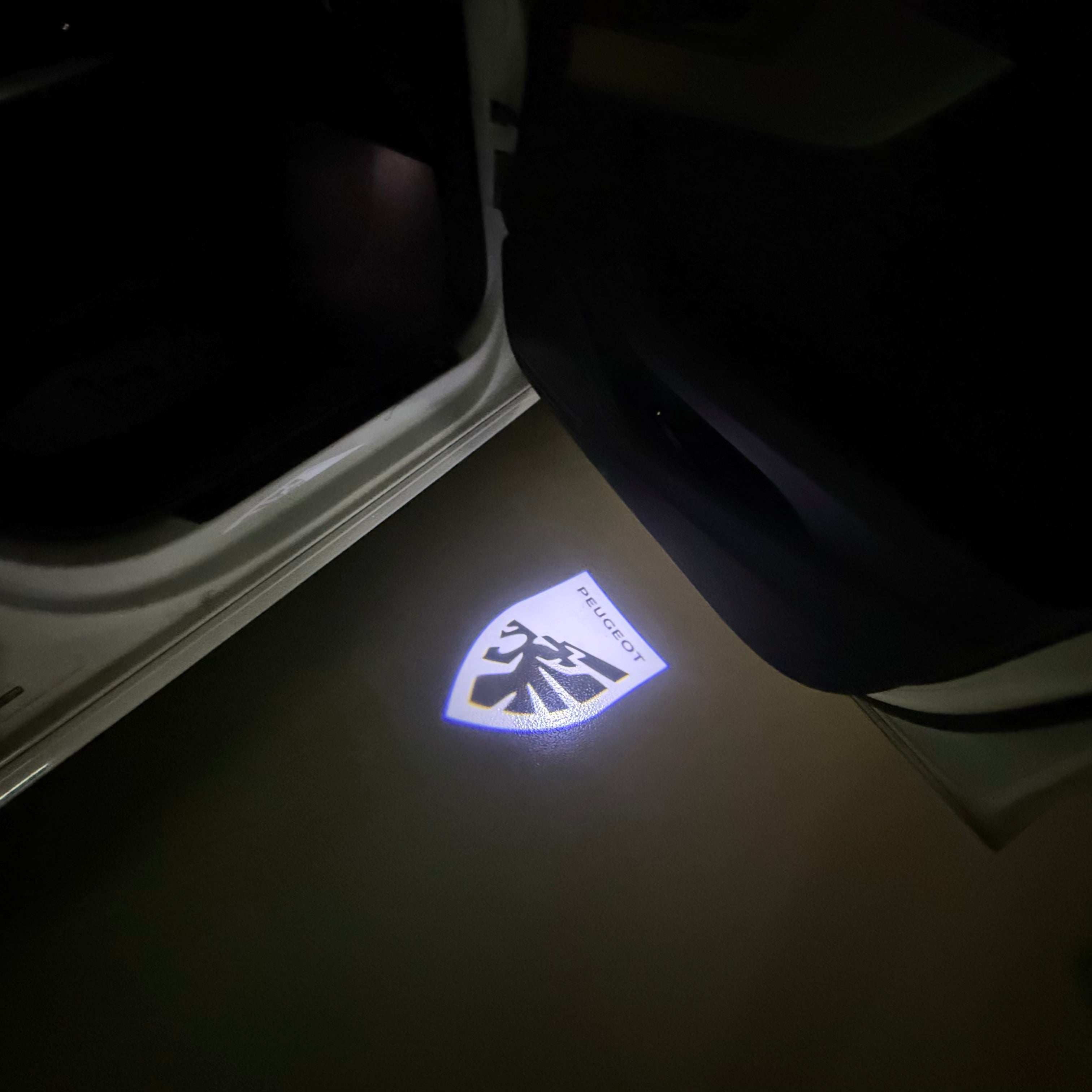 PEUGEOT ORIGINAL  LOGO PROJECTOT LIGHTS (quantity 1 = 1 sets/2 door lights) Nr.6024q66