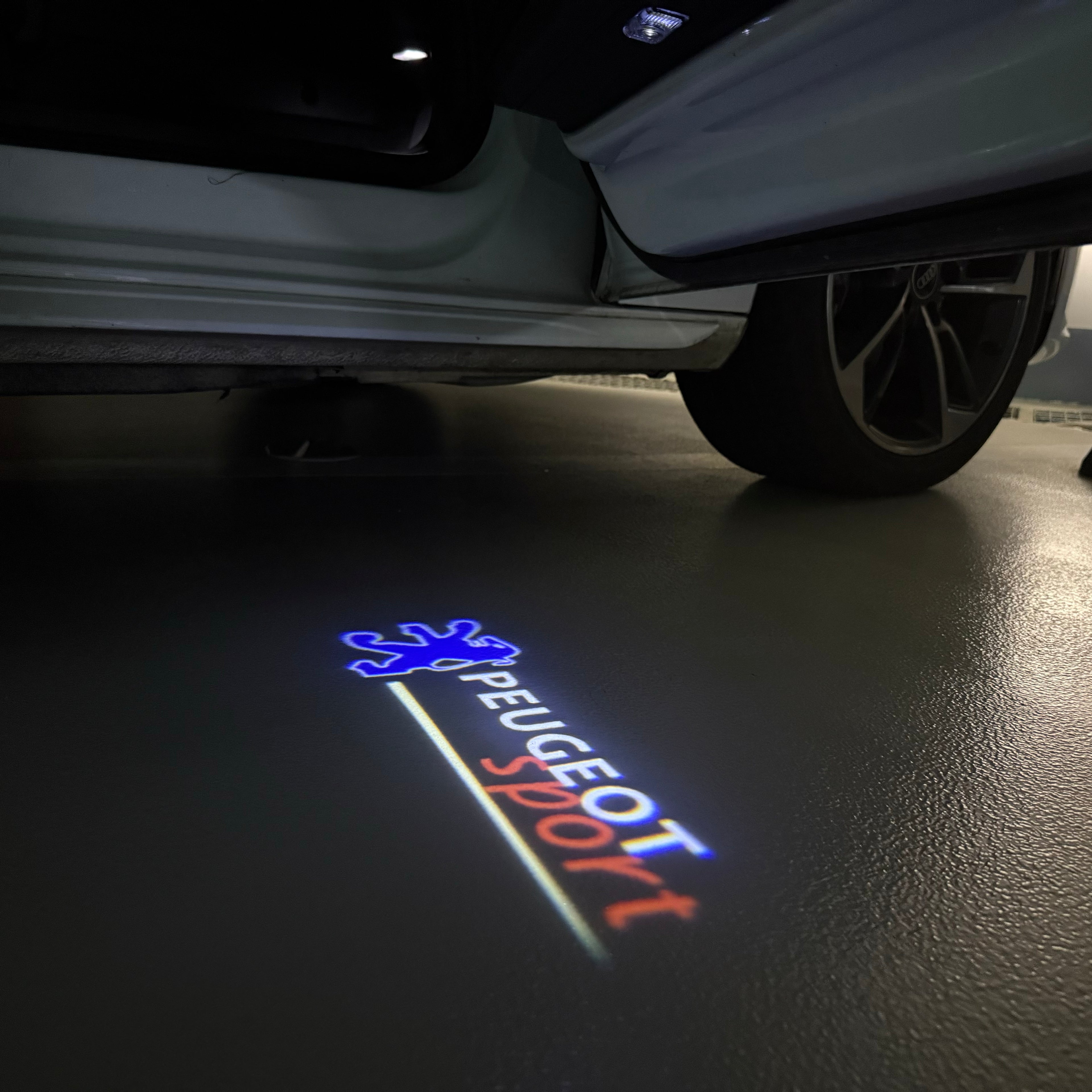 PEUGEOT SPORT  LOGO PROJECTOT LIGHTS (quantity 1 = 1 sets/2 door lights) Nr.6024q77