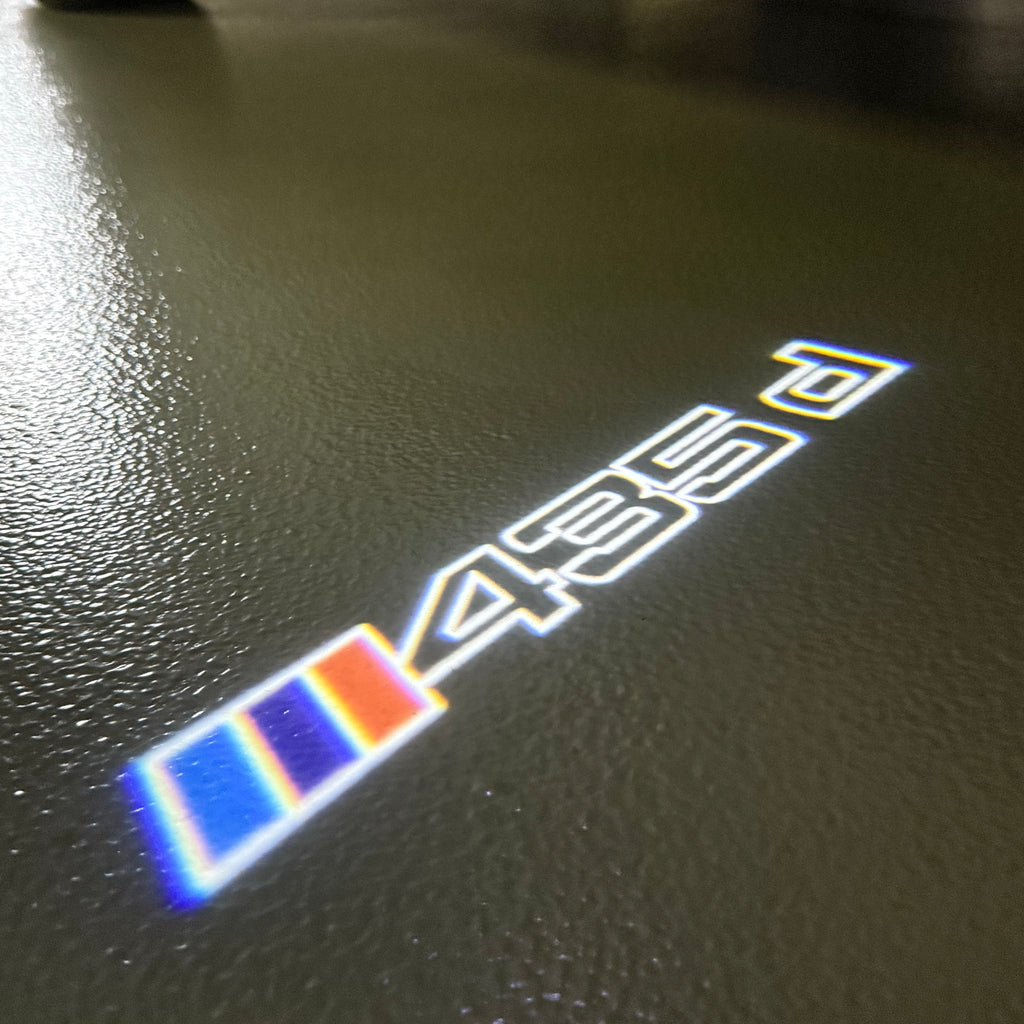 BMW M3 LOGO PROJECTOR LIGHTS Nr.24 (الكمية 1 = 1 مجموعة / 2 أضواء باب)