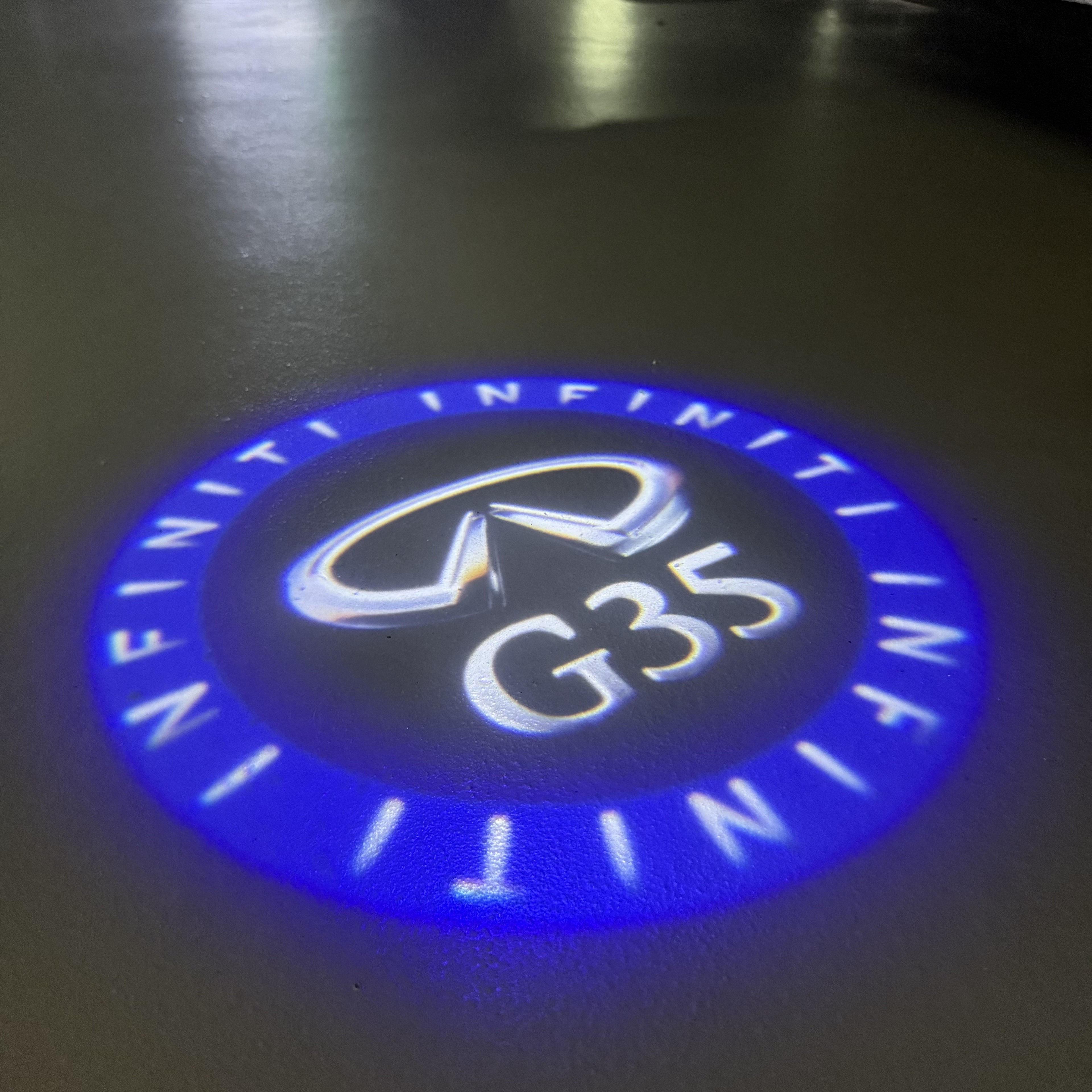 LUCI PROIETTORI LOGO INFINITI QX56 Nr.74 (quantità 1 = 1 set / 2 luci porta)