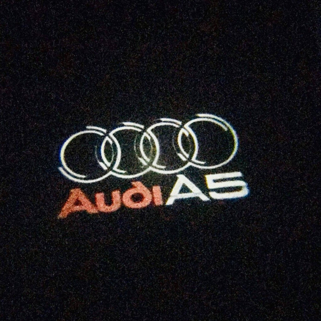 AUDI LOGO PROJECTOT LIGHTS Nr.43 (Menge 1 = 2 Logofolien /2 Türleuchten)