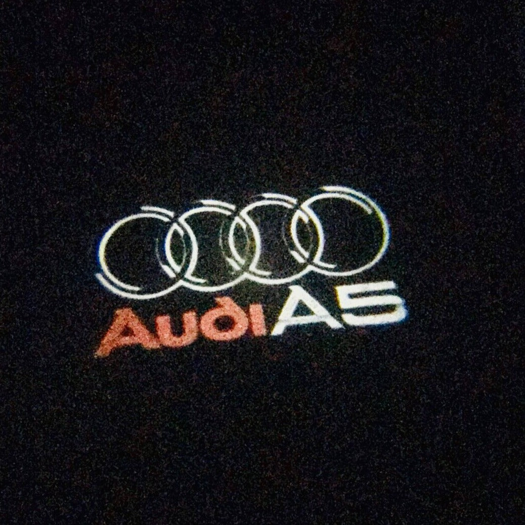 AUDI LOGO PROJECTOT LIGHTS Nr.43 (Menge 1 = 2 Logofolien /2 Türleuchten)