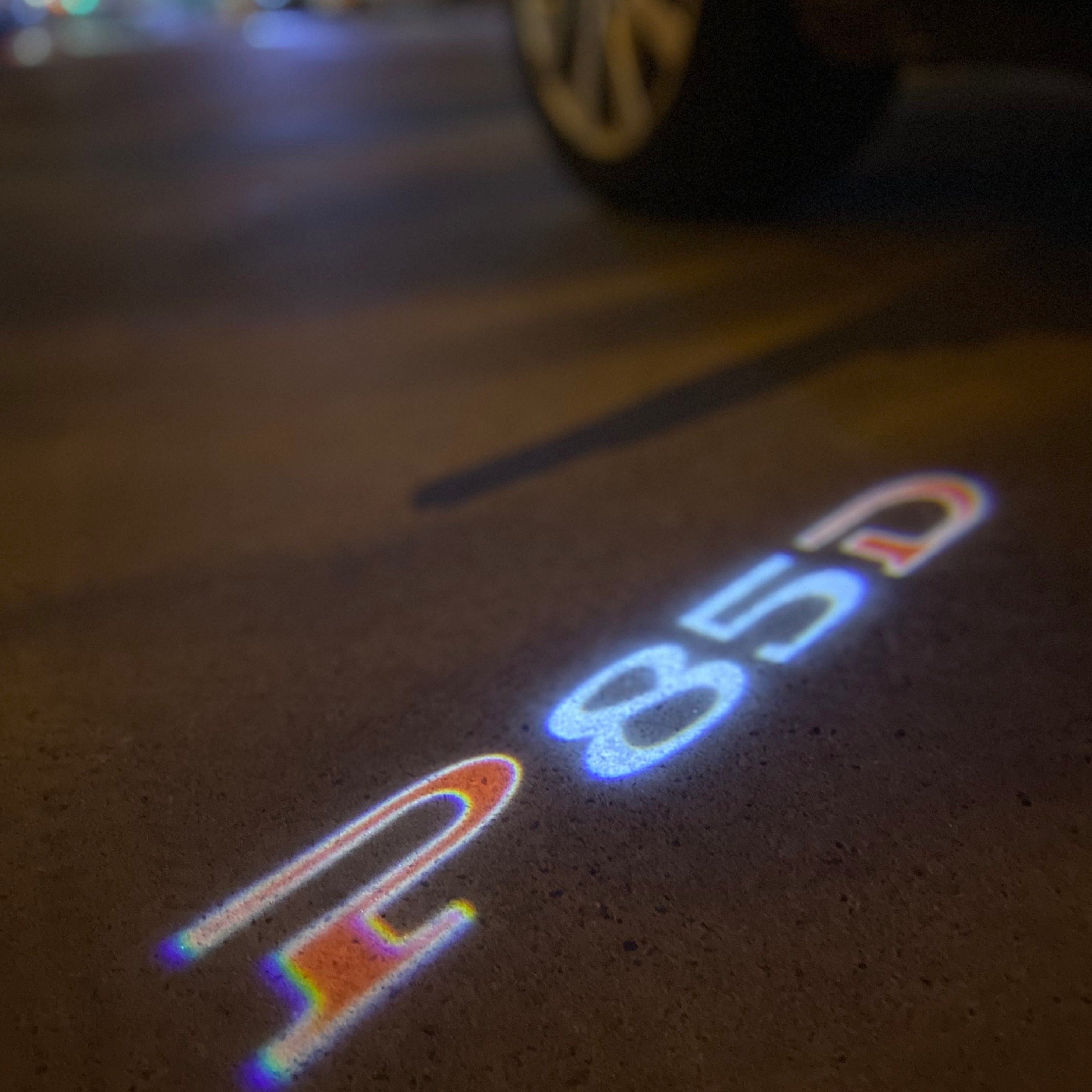TESLA P85D LOGO PROJECROTR LIGHTS Nr.1529  (quantity  1 =  2 Logo Film /  2 door lights)