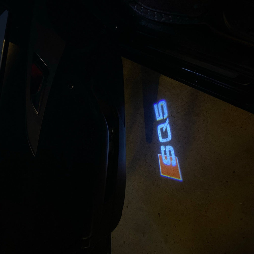 AUDI LOGO PROJECTOT LIGHTS Nr.58 (Menge 1 = 2 Logofolien /2 Türleuchten)