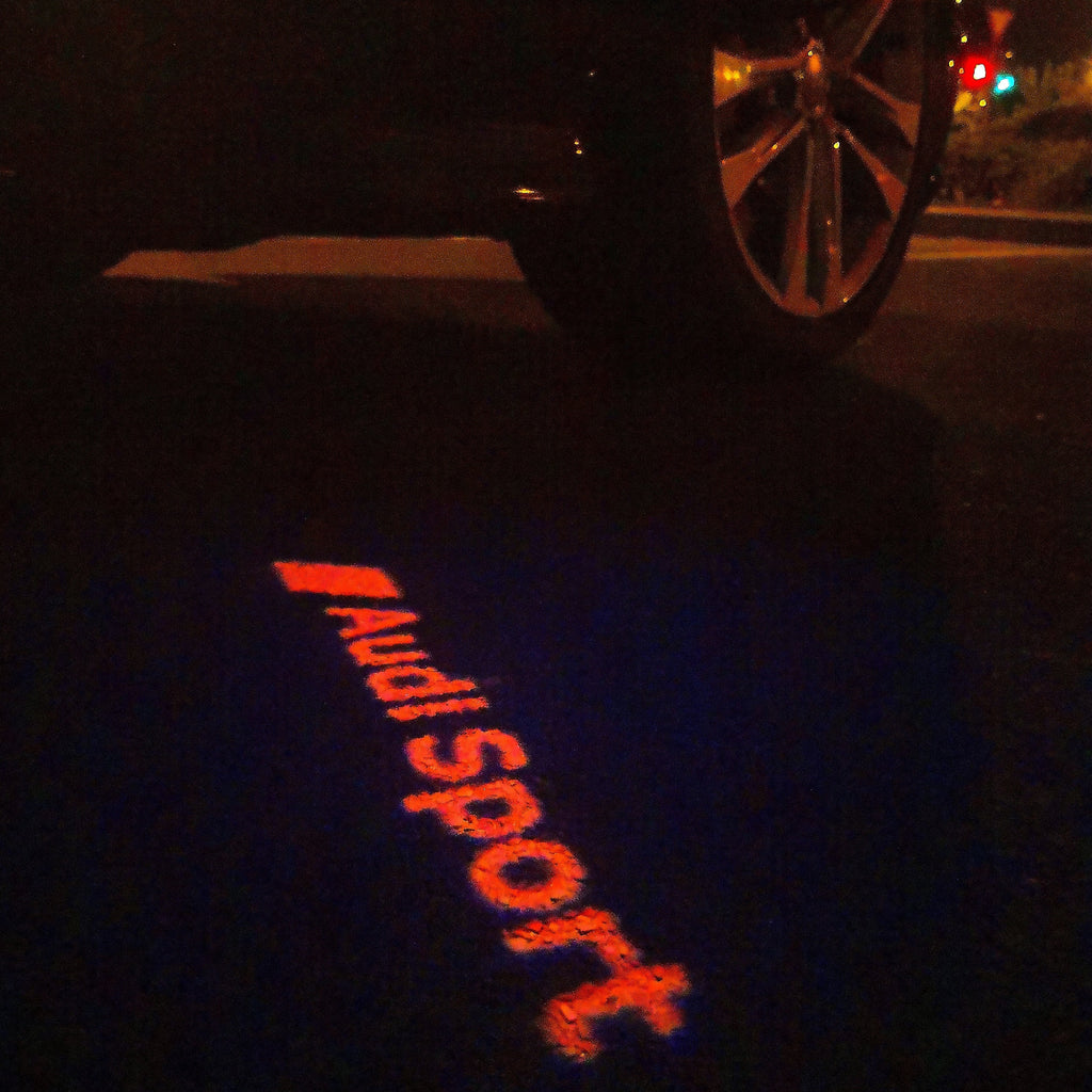 AUDI LOGO PROJECTOT LIGHTS Nr.111 (الكمية 1 = 2 Logo Films /2 أضواء الباب)