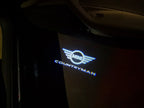 LUCES DE PROYECTOR CON LOGO MINI COUNTRYMAN Nr.131 (cantidad 1 = 2 Película de Logo / 2 luces de puerta)