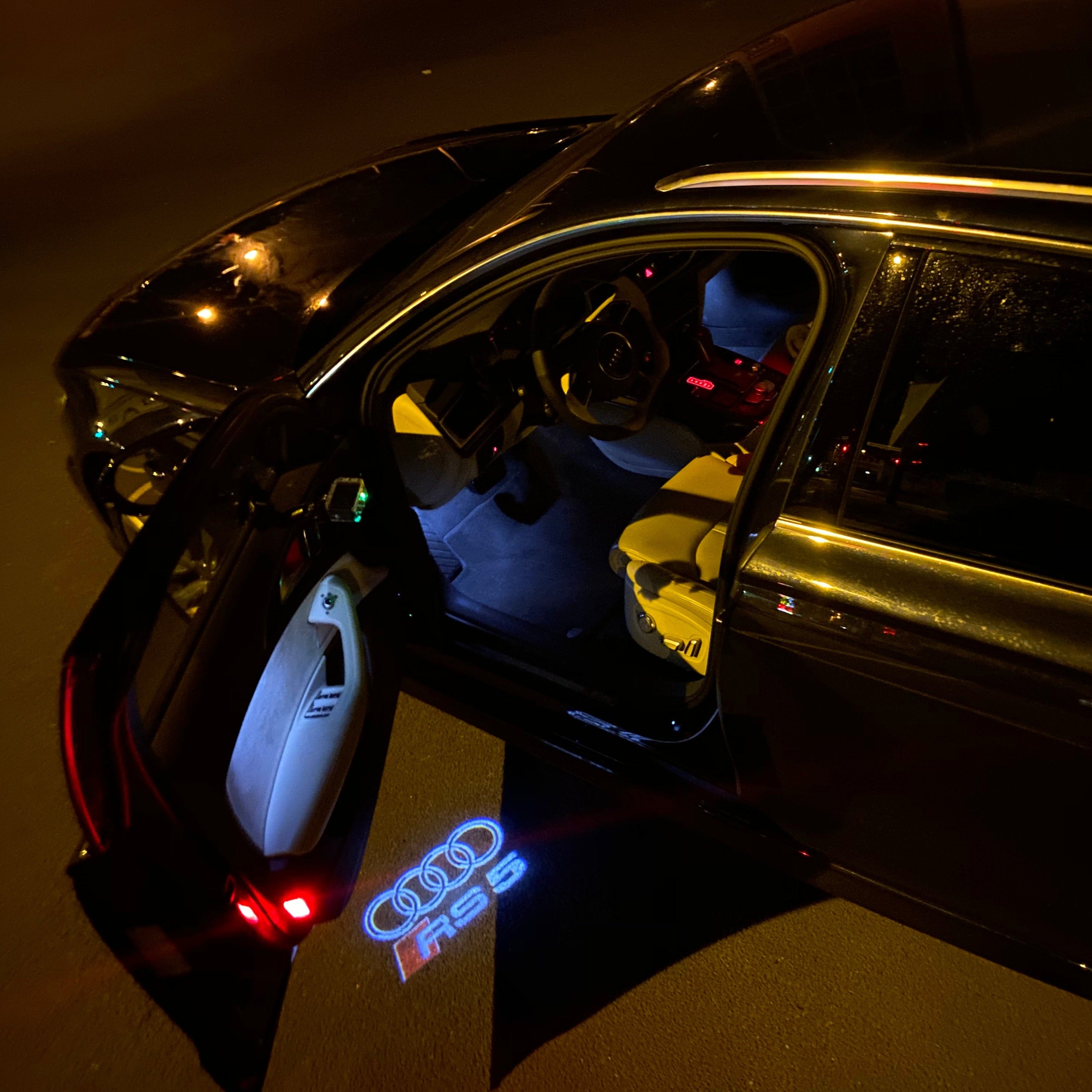 AUDI LOGO PROJECTOT LIGHTS Nr.136 (الكمية 1 = 2 Logo Films /2 أضواء الباب)