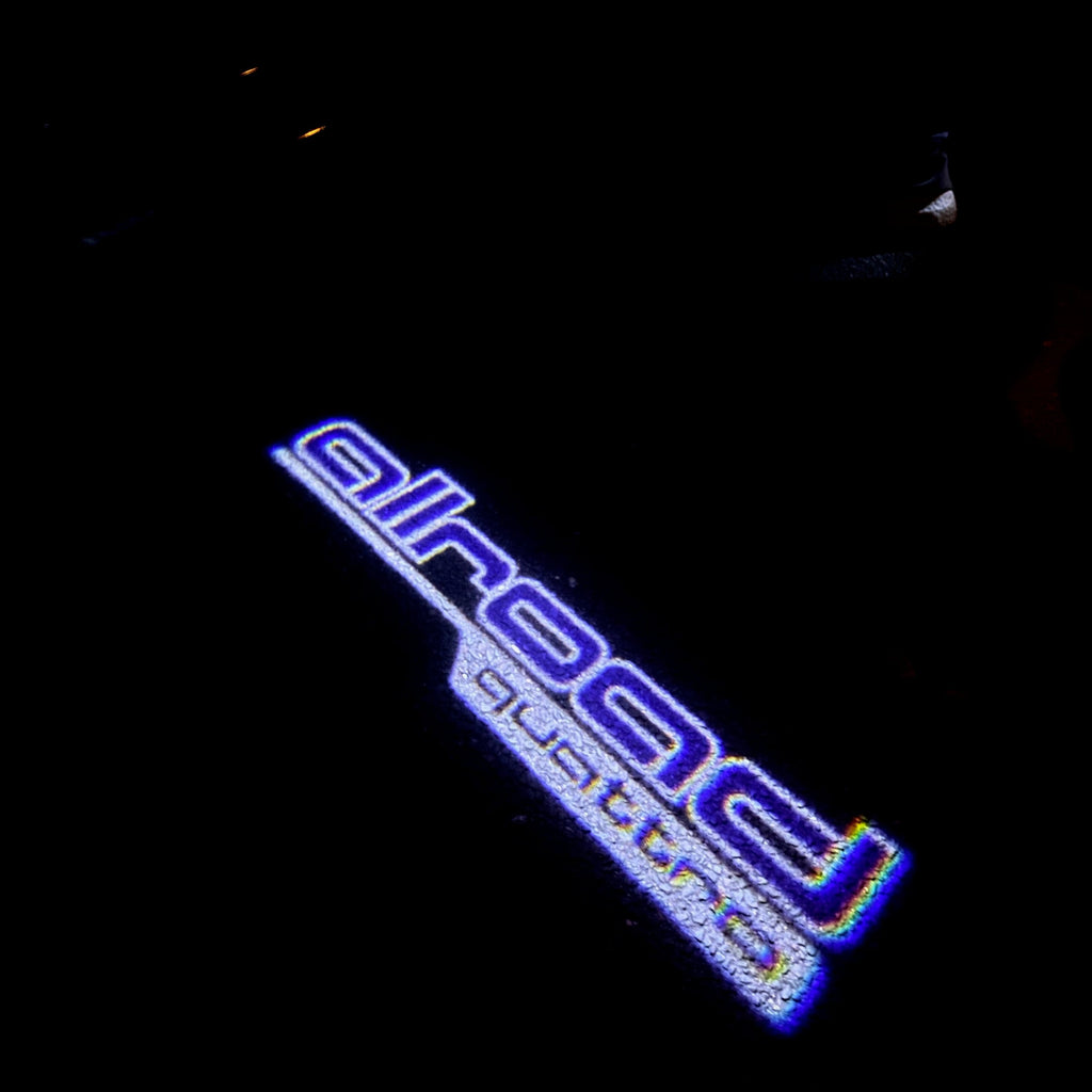 LUCES DE PROYECTOR LOGO AUDI Nr.161 (cantidad 1 = 2 películas con logotipo / 2 luces de puerta)