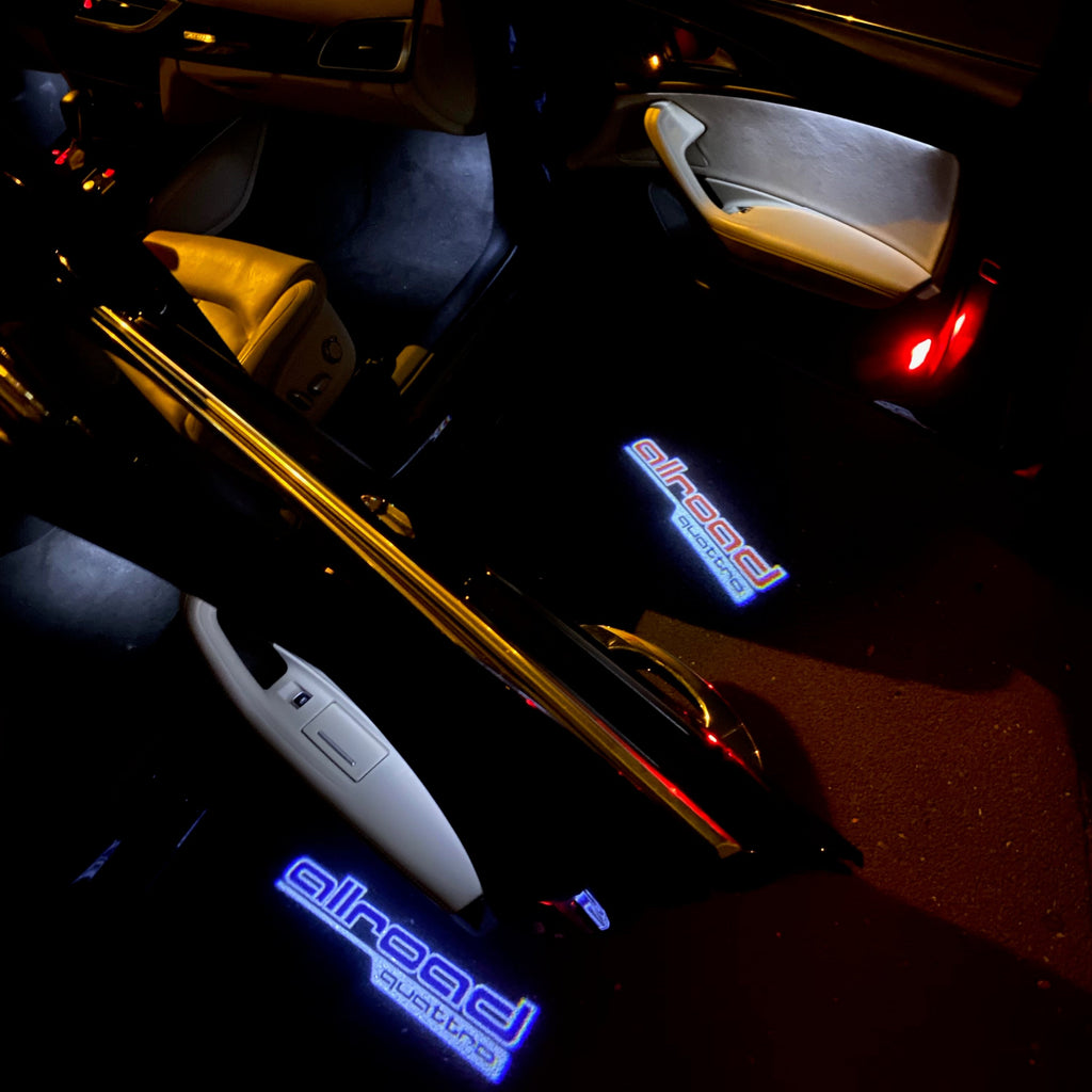 LUCES DE PROYECTOR LOGO AUDI Nr.161 (cantidad 1 = 2 películas con logotipo / 2 luces de puerta)