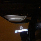 LUCES DE PROYECTOR LOGO MERCEDES BENZ BRABUS Nr.24 (cantidad 1 = 1 juegos / 2 luces de puerta)