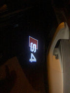 AUDI LOGO PROJECTOT LIGHTS Nr.25 (cantidad 1 = 2 películas con logotipo /2 luces de puerta)