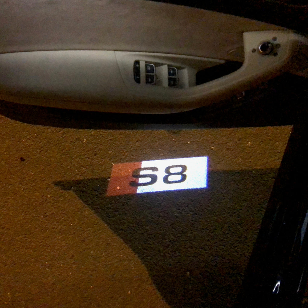 AUDI LOGO PROJECTOT LIGHTS Nr.135 (الكمية 1 = 2 Logo Films /2 أضواء الباب)