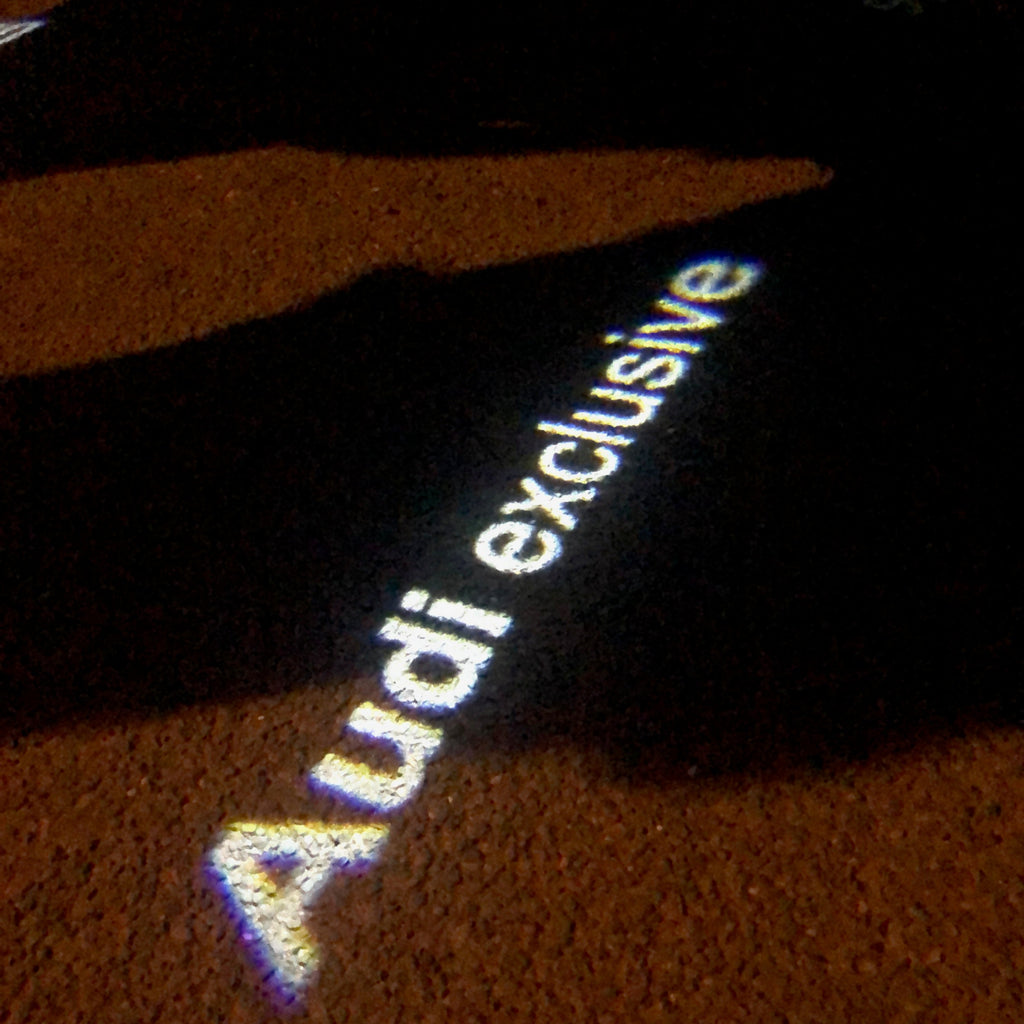 AUDI LOGO PROJECTOT LIGHTS Nr.73 (Menge 1 = 2 Logofolien /2 Türleuchten)