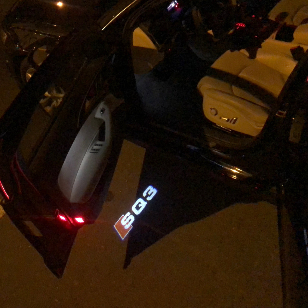 LUCES DE PROYECTOR LOGO AUDI Nr.57 (cantidad 1 = 2 películas con logotipo / 2 luces de puerta)