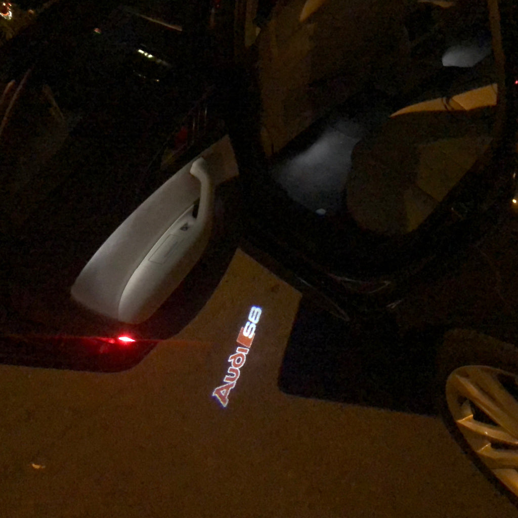 AUDI LOGO PROJECTOT LIGHTS Nr.94 (Menge 1 = 2 Logofolien /2 Türleuchten)