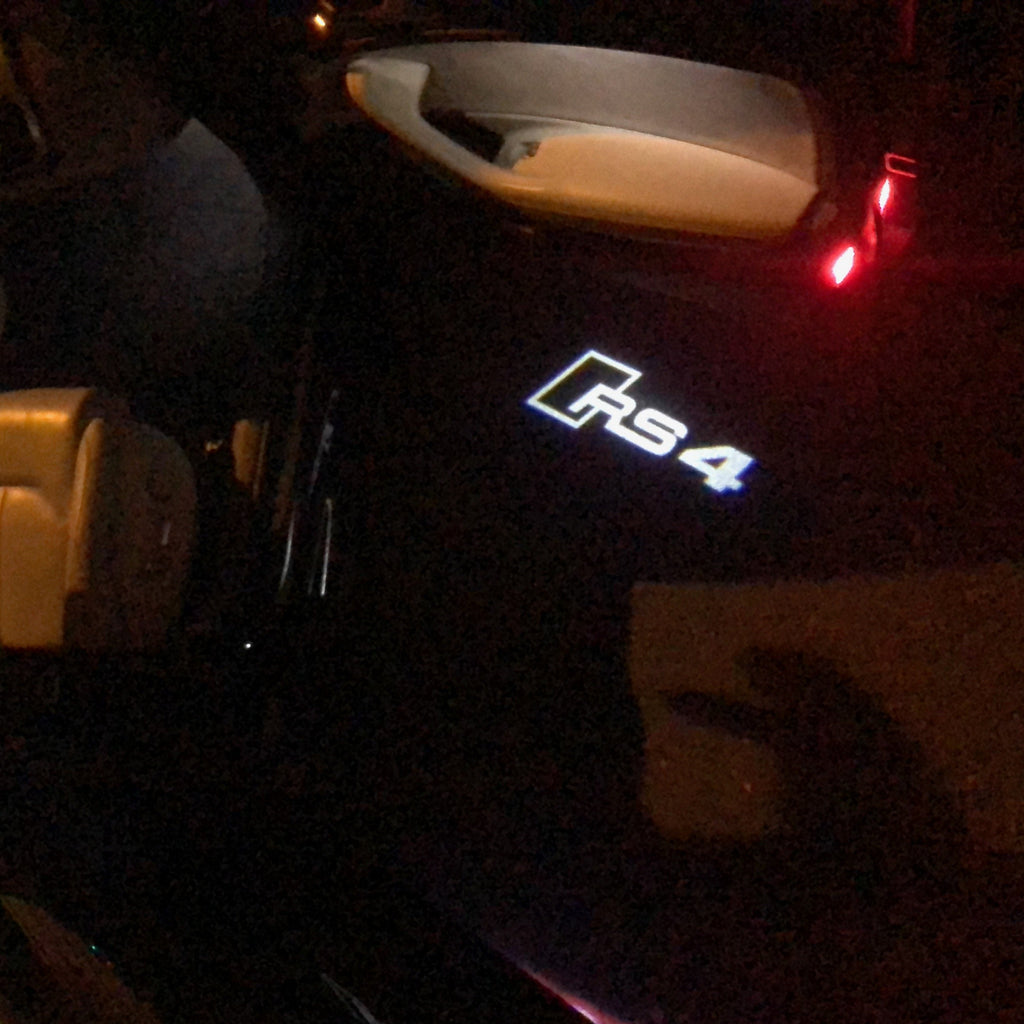 أضواء جهاز عرض شعار AUDI رقم 118 (الكمية 1 = 2 فيلم شعار / 2 مصباح باب)
